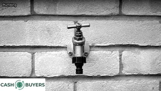 water leak on side of house